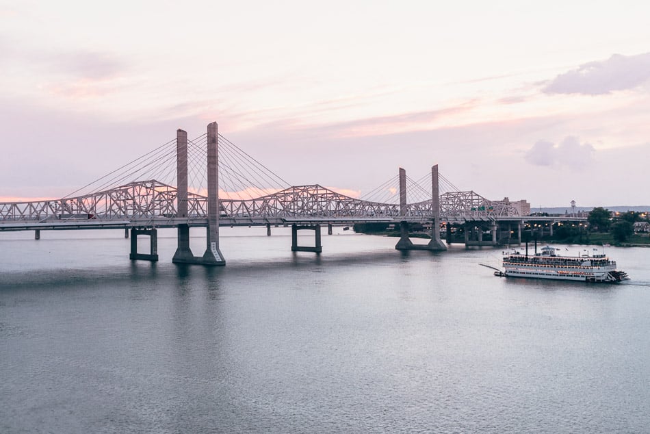 The Belle of Louisville returning home underneath a pink sunset on the Ohio River in Louisville, Kentucky.