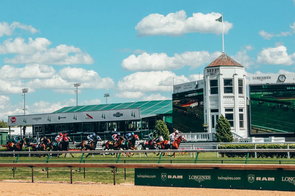 Horses crossing the finish line of the Kentucky Derby Louisville Kentucky