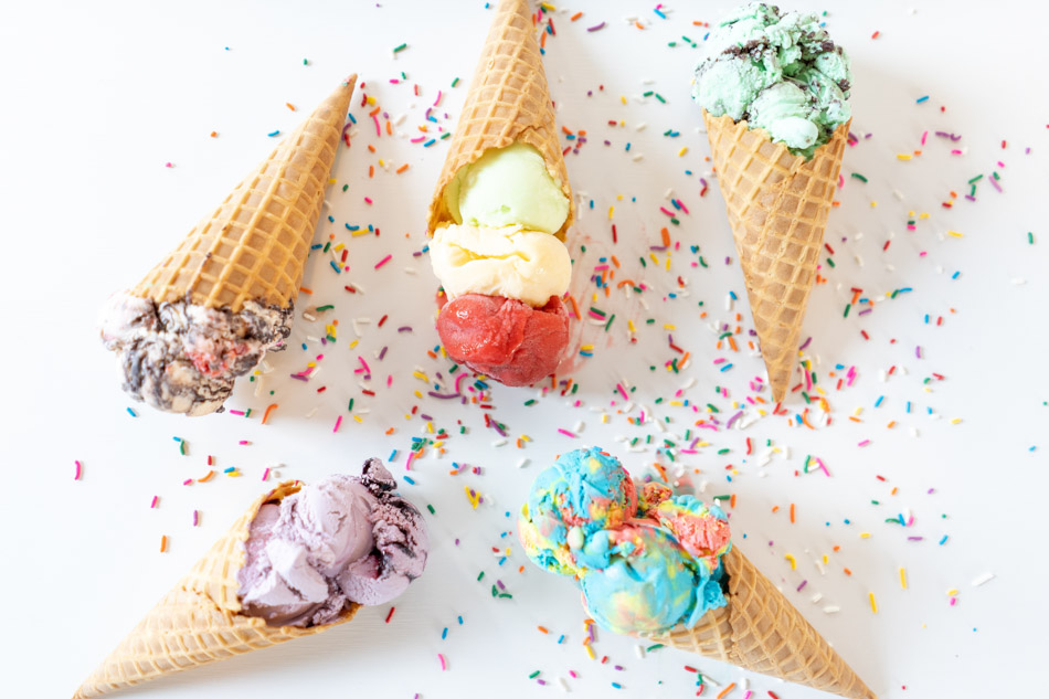 An array of different colored ice cream cones unsplash