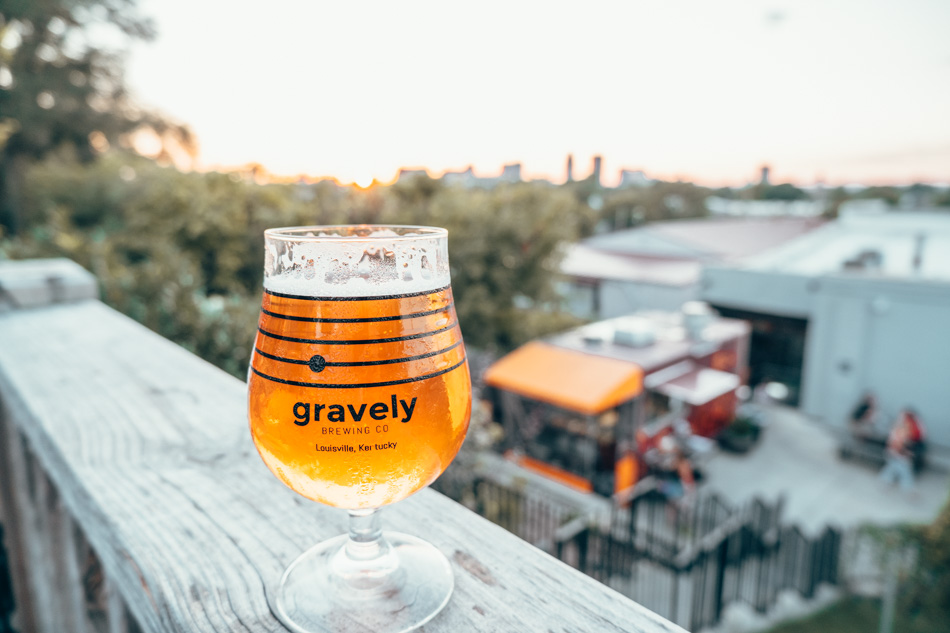 Beer overlooking the sunset and the city skyline from the upper patio at Gravely Breweing Co. in Louisville KY
