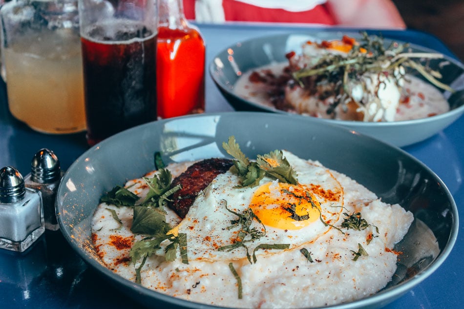 Brunch dish of eggs, pork belly and grits at Gralehaus in Louisville, Kentucky