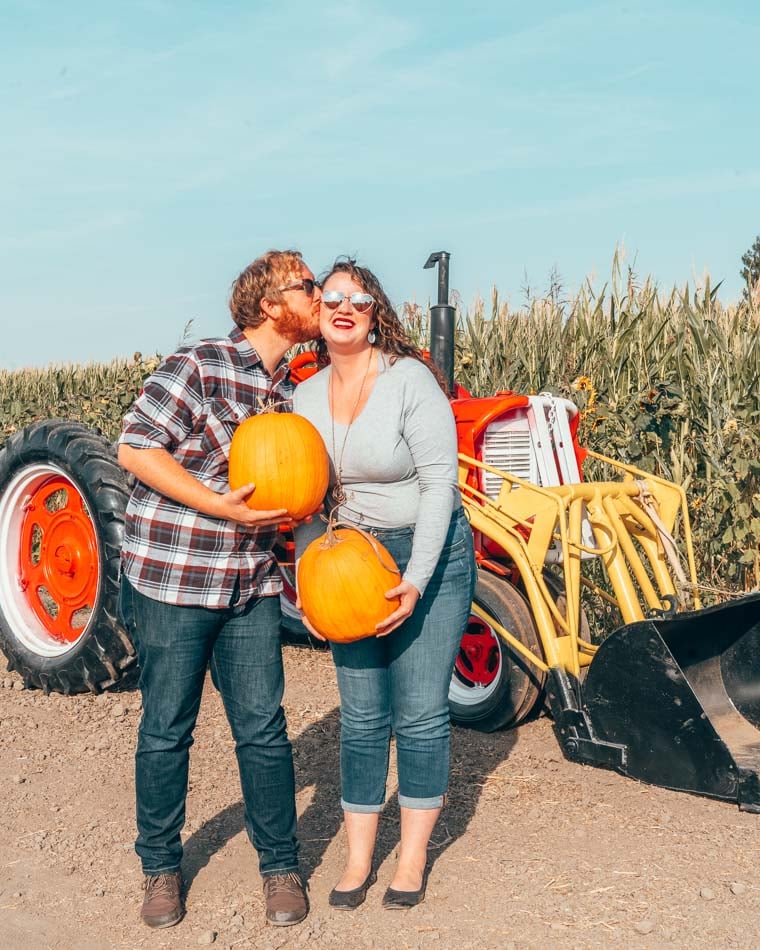 Couple at a pumpkin patch.