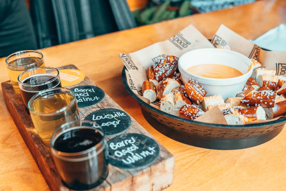 Goodwood Brewing beer flight and beer cheese with pretzels on the NuLu food & history walking tour with Louisville Food Tours