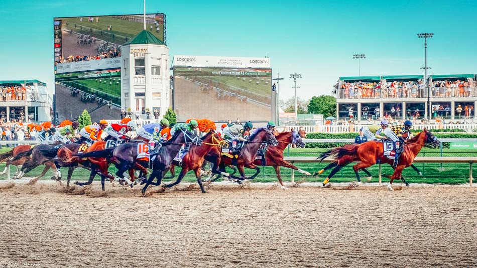 Horses crossing the finish line of the Kentucky Derby Louisville Kentucky
