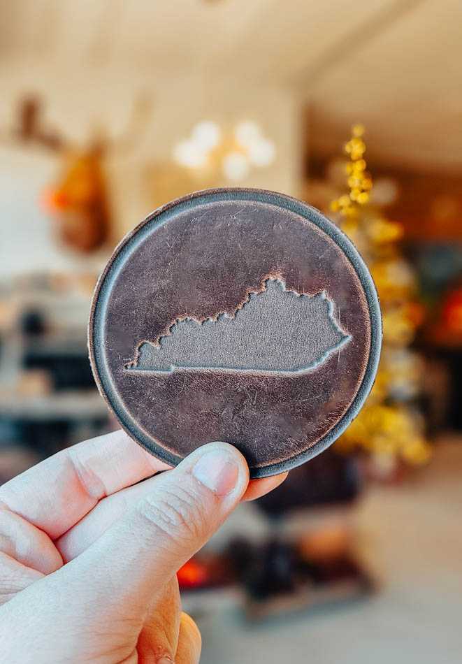 Leather coaster inlaid with the shape of Kentucky 
