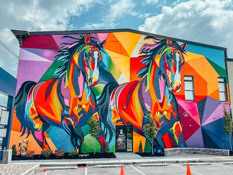 "The Unified Race" Horse mural on the side of the NuLu Marketplace in Louisville, Kentucky created by The Art of Kacy