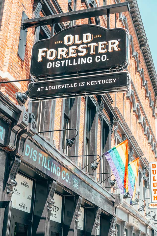 Old Forester Distillery and Pride flag on Whiskey Row in Louisville Kentucky
