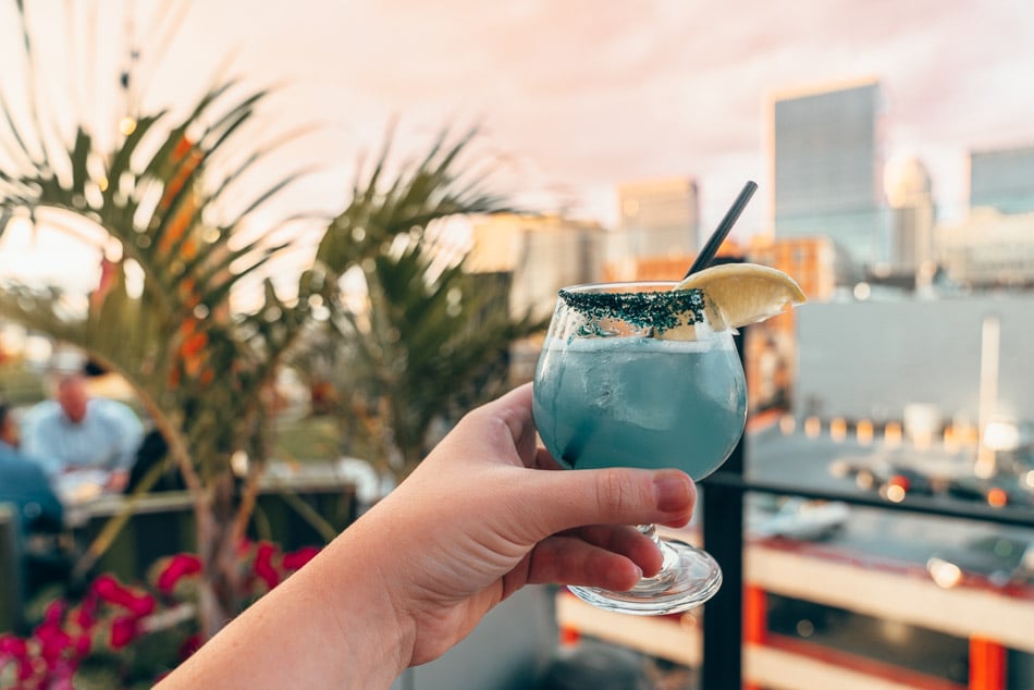 Cocktail at sunset at 8up Rooftop Bar in downtown Louisville Kentucky