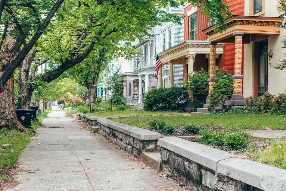 Victorian homes lining the sidewalk in the Highlands neighborhood in Louisville, Kentucky