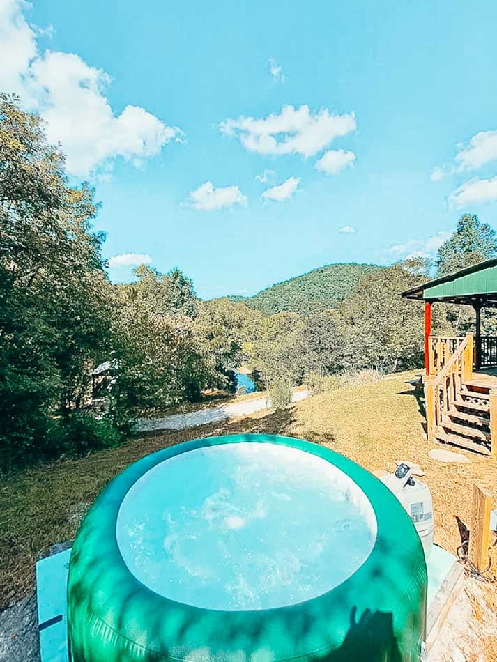 hot tub over looking river at cabin in kentucky