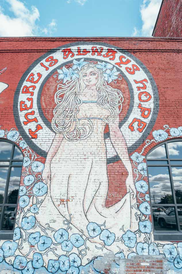 mucha-style woman butchertown market mural louisville ky