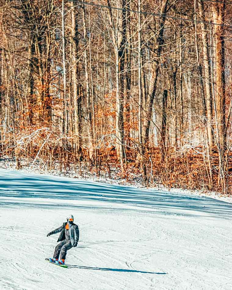 snowboarder snowboarding at paoli peaks in paoli indiana